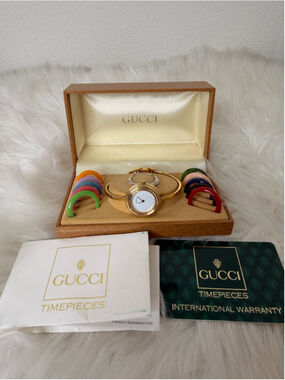 Gucci 11/12.2 Interchangeable Bezel Bangle Watch, w/ 12 bezels, box & paperwork